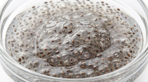 Chia seeds soaking in water forming gel texture